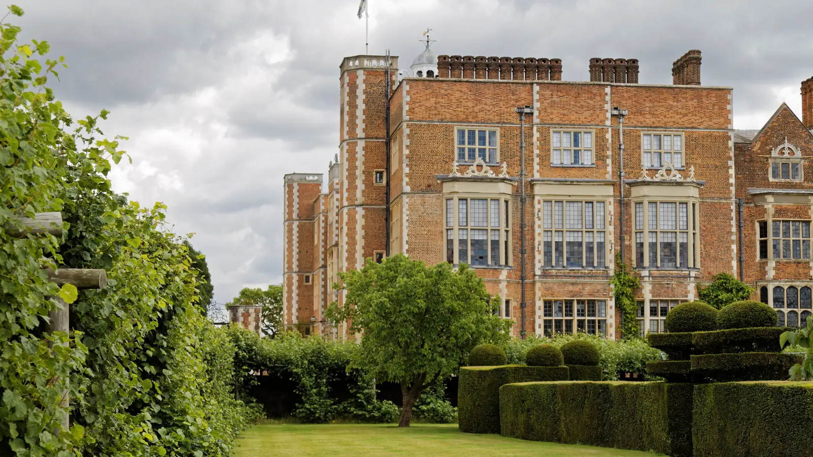 Hatfield House in Hertfordshire, its halls and gardens appear throughout Bridgerton