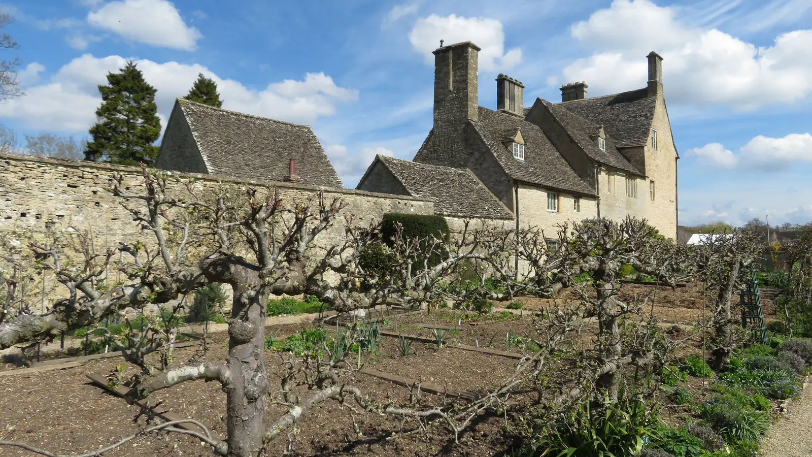 The manor house and kitchen garden at Cogges, Yew Tree Farm in Downton Abbey
