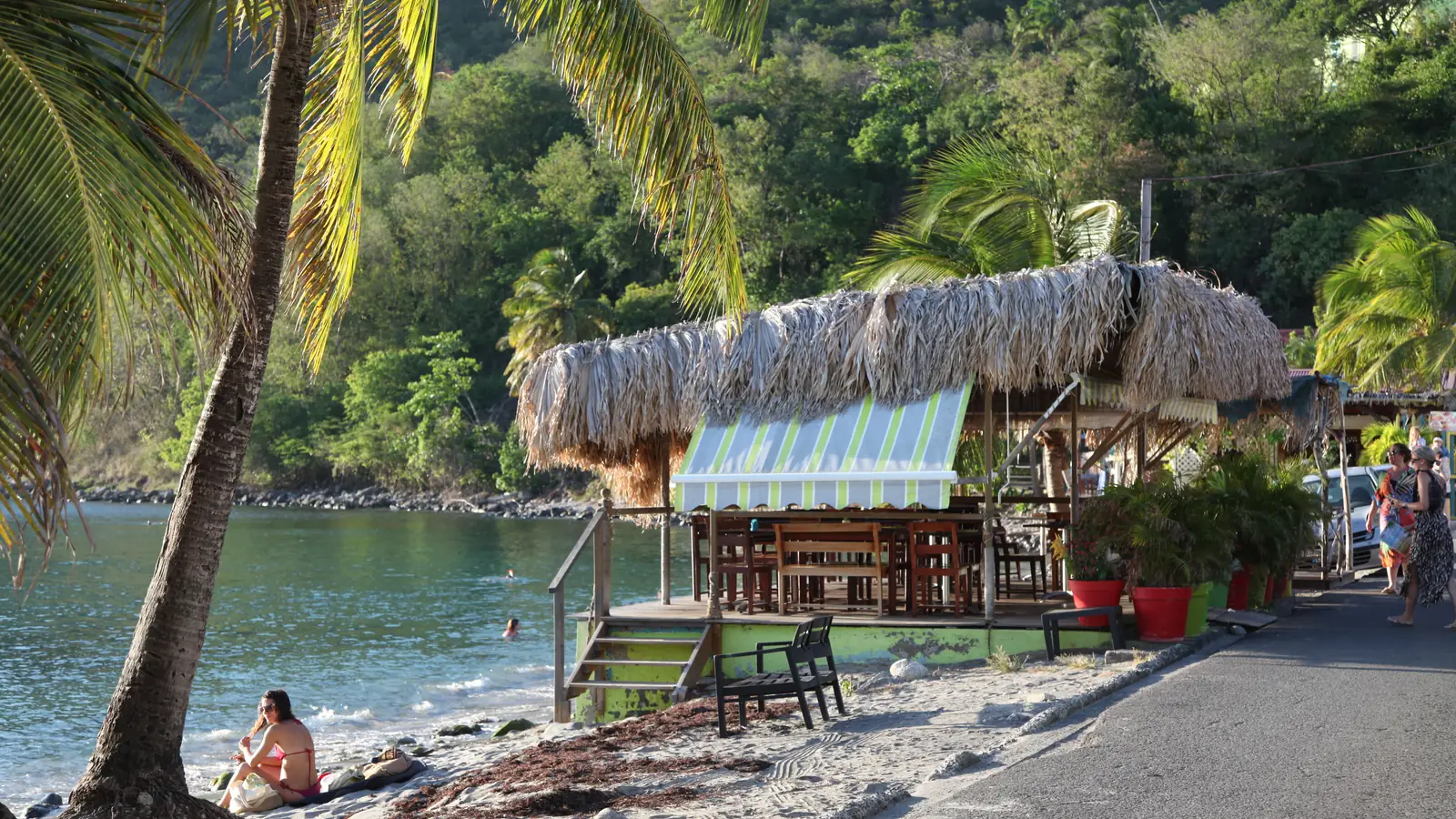 The waterfront terrace of the restaurant Le Madras in Deshaies – Catherine's Bar in Death in Paradise.
