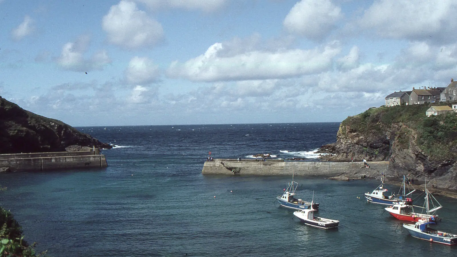 Port Isaac harbour at low tide with boats on the Platt – Portwenn harbour, the setting of almost every episode.