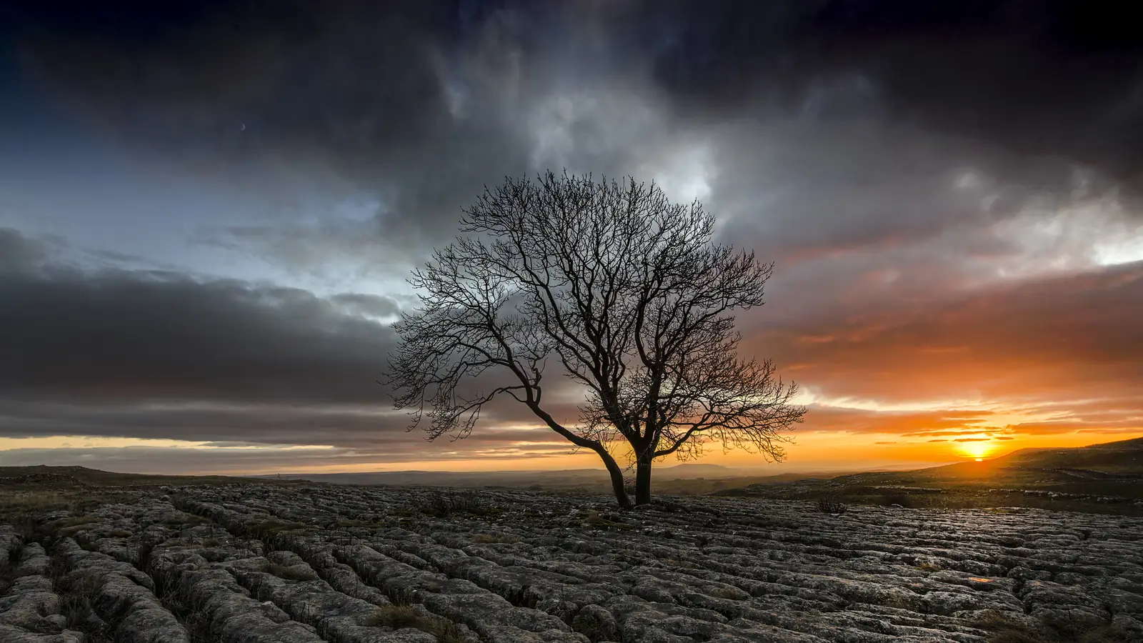 The limestone pavement above Malham Cove at sunset