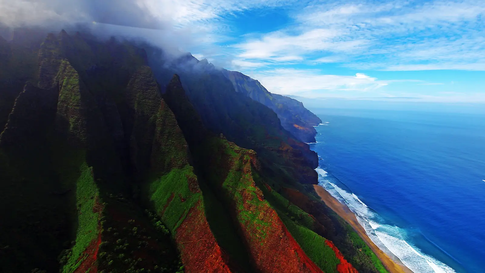 Sea cliffs of the Na Pali Coast, Kauai, from the air – the approach to Isla Nublar in Jurassic Park