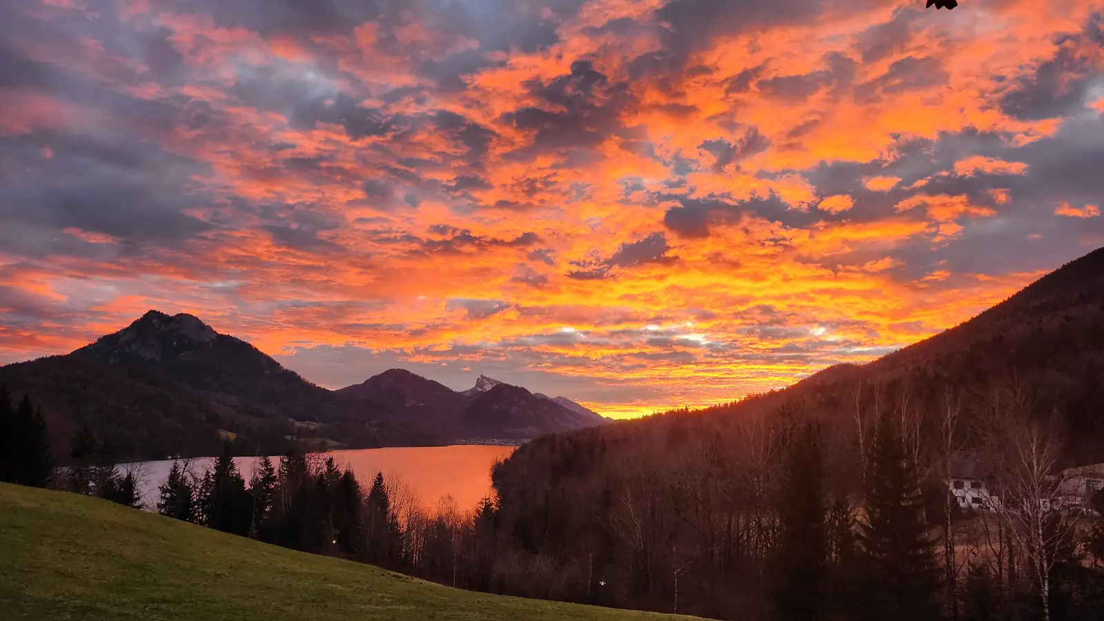 Sunset over Fuschlsee in the Salzkammergut, the lakes of the opening aerial shots